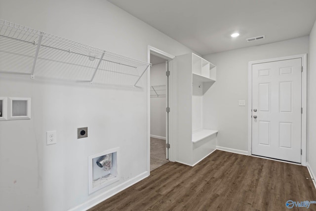 washroom with dark hardwood / wood-style floors and electric dryer hookup