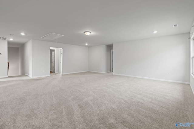 unfurnished room with light carpet