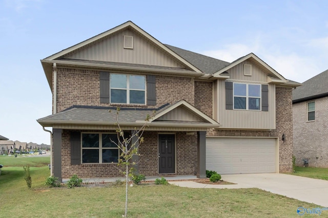 view of front of house with a garage and a front yard