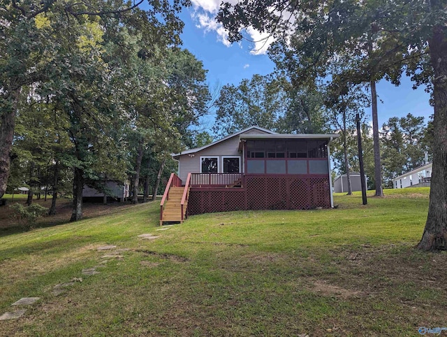 view of yard with a deck and a sunroom