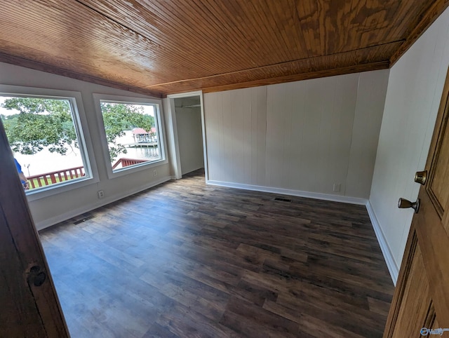 unfurnished room with wood ceiling, dark hardwood / wood-style flooring, and vaulted ceiling