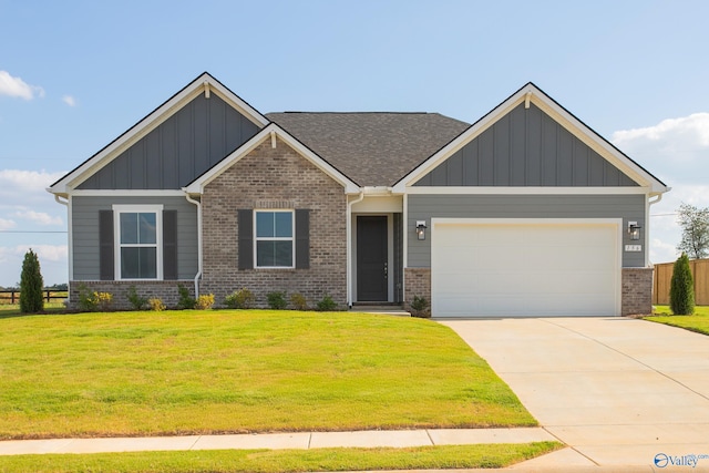 craftsman-style house with a garage and a front lawn