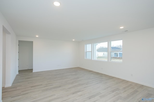 unfurnished room featuring light hardwood / wood-style floors