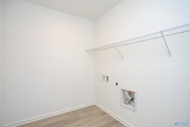 laundry room with washer hookup, light hardwood / wood-style flooring, and hookup for an electric dryer