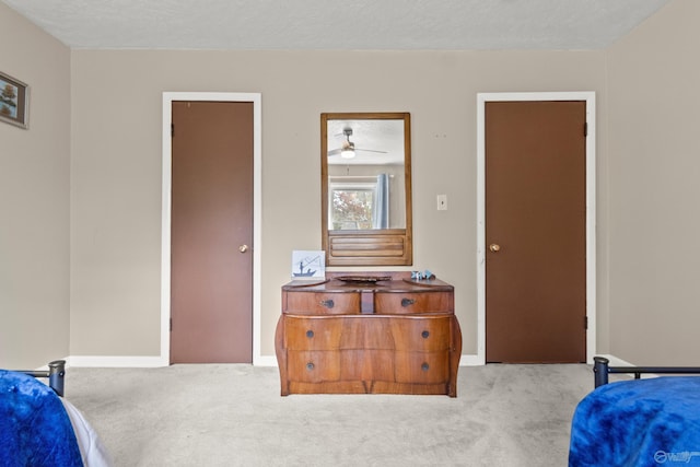 carpeted bedroom with a textured ceiling