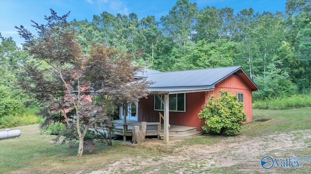 view of front of property with a front lawn and a wooden deck