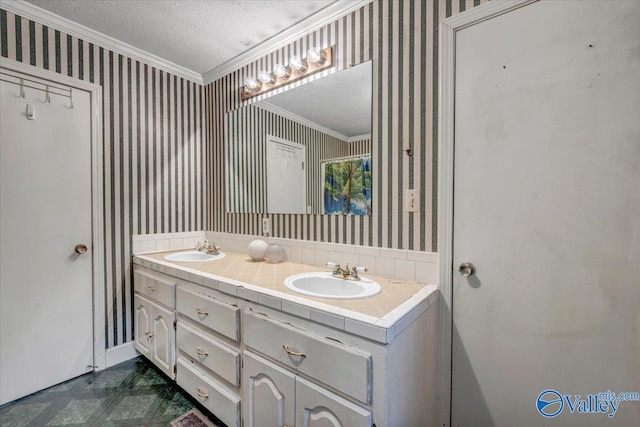 bathroom with vanity, crown molding, and a textured ceiling