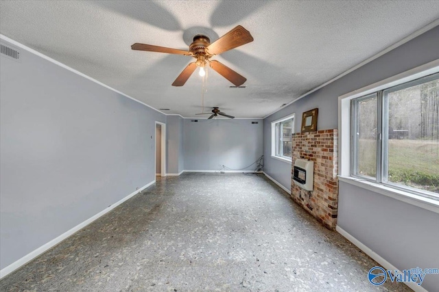 unfurnished living room featuring heating unit, a brick fireplace, a textured ceiling, and ceiling fan