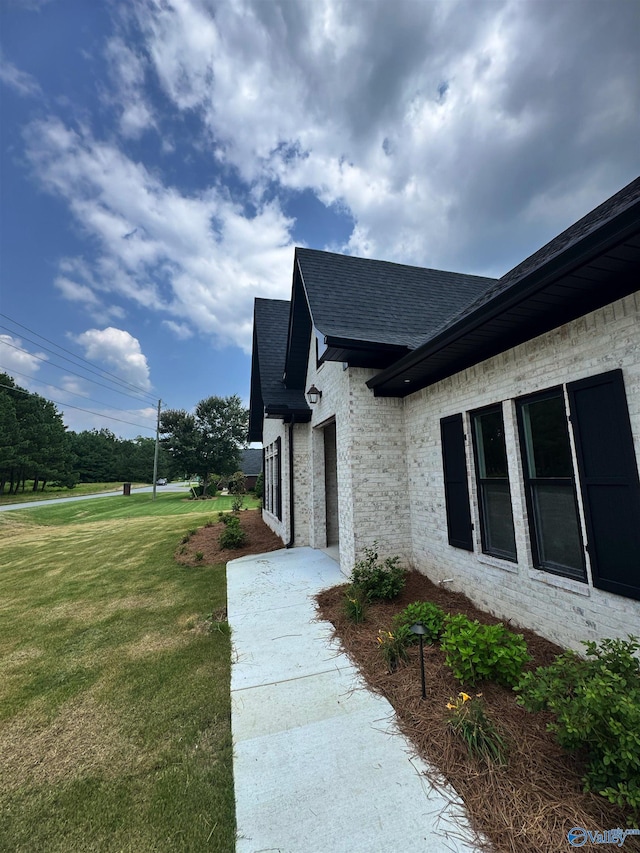 4829 Whorton Bend Rd, Gadsden, AL 35901 - doorway to property featuring a lawn, roof with shingles, and brick siding