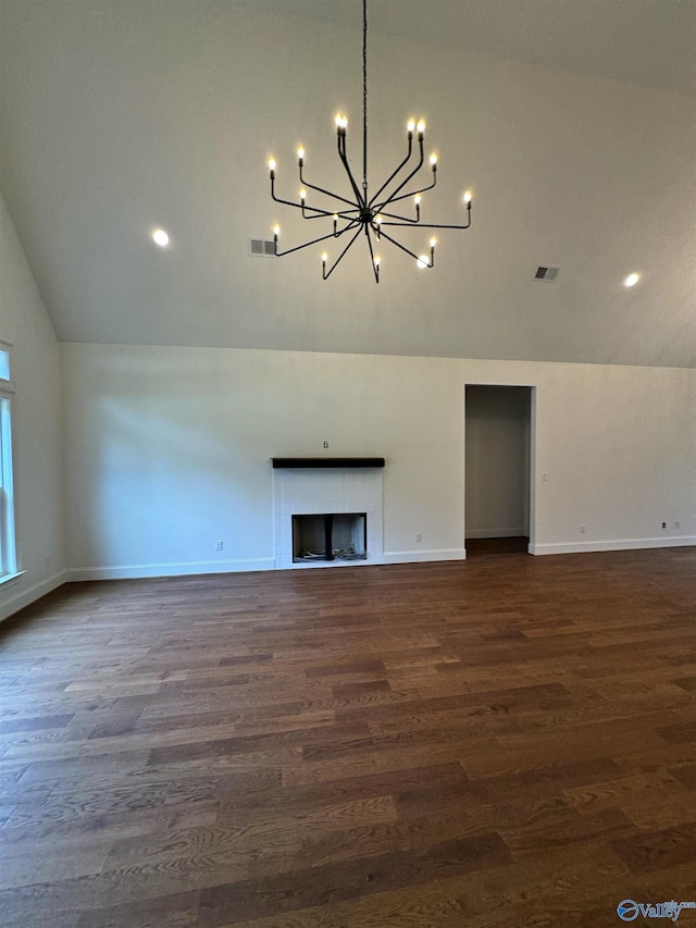 4829 Whorton Bend Rd, Gadsden, AL 35901 - unfurnished living room featuring lofted ceiling, a chandelier, dark wood-style flooring, a fireplace, and recessed lighting