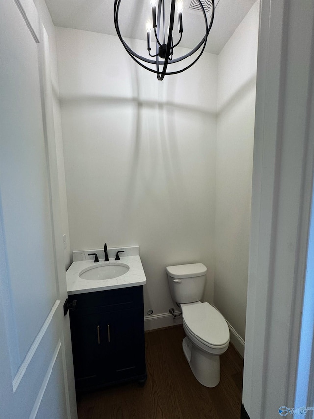 4829 Whorton Bend Rd, Gadsden, AL 35901 - bathroom with wood finished floors, a chandelier, and vanity