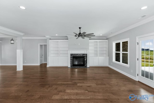 unfurnished living room featuring ceiling fan, a fireplace, dark hardwood / wood-style flooring, and ornamental molding