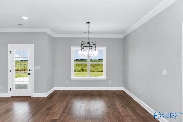 unfurnished dining area featuring crown molding, dark hardwood / wood-style flooring, and a notable chandelier