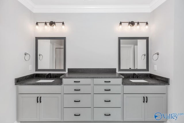 bathroom with visible vents, crown molding, and vanity