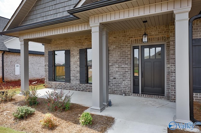 entrance to property featuring a porch