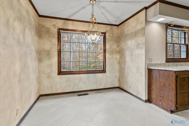 unfurnished dining area with crown molding, light tile patterned flooring, and an inviting chandelier