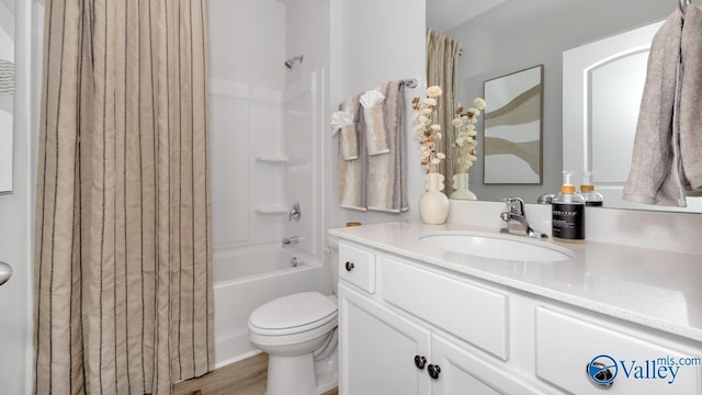 full bathroom with shower / bath combination with curtain, vanity, toilet, and hardwood / wood-style floors