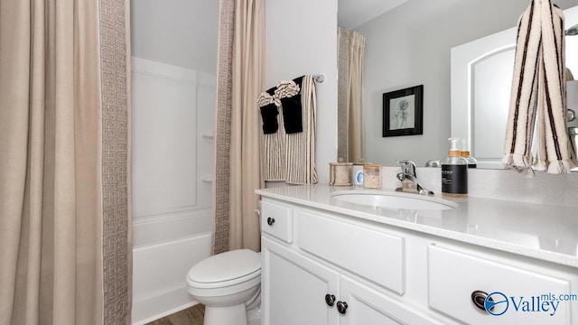 full bathroom featuring vanity, toilet, and shower / bath combo with shower curtain