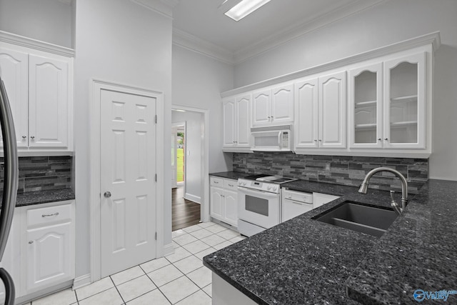 10214 New Cut Rd, Athens, AL 35611 - kitchen with white appliances, crown molding, light tile patterned flooring, white cabinetry, and decorative backsplash