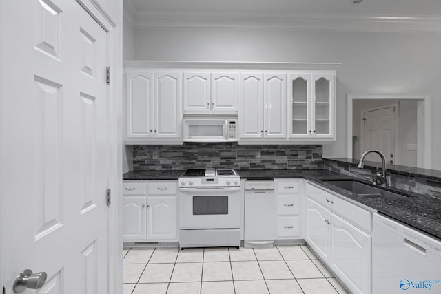 10214 New Cut Rd, Athens, AL 35611 - kitchen featuring white appliances, ornamental molding, white cabinets, light tile patterned floors, and dark stone countertops