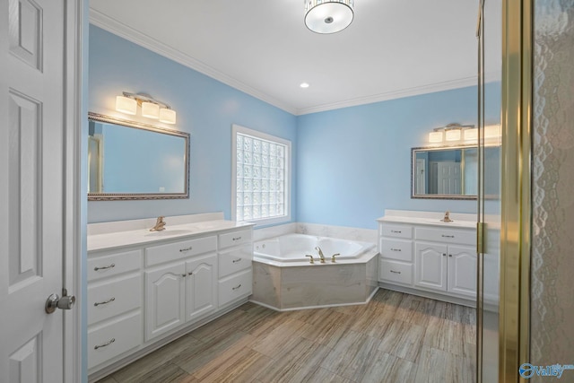 10214 New Cut Rd, Athens, AL 35611 - full bathroom with two vanities, crown molding, and a garden tub