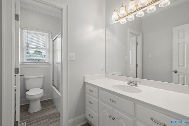 10214 New Cut Rd, Athens, AL 35611 - bathroom featuring vanity, bath / shower combo with glass door, ornamental molding, and wood finished floors