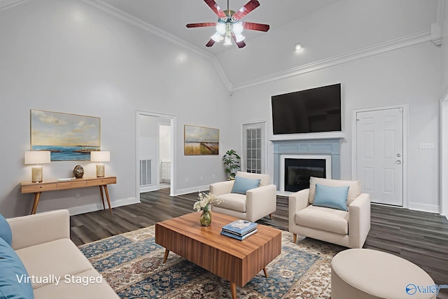 10214 New Cut Rd, Athens, AL 35611 - living area with dark wood finished floors, crown molding, ceiling fan, high vaulted ceiling, and a fireplace