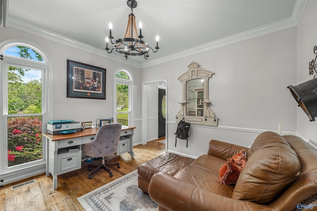 office space with a notable chandelier, light hardwood / wood-style flooring, and crown molding