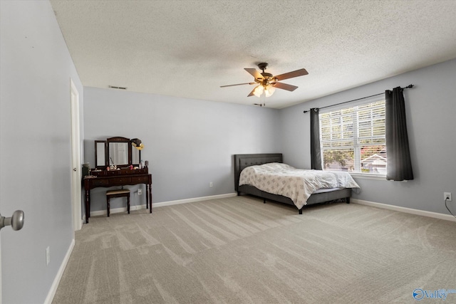 bedroom featuring baseboards and light colored carpet