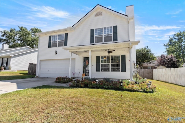 traditional home featuring a garage, concrete driveway, a chimney, fence, and a front yard