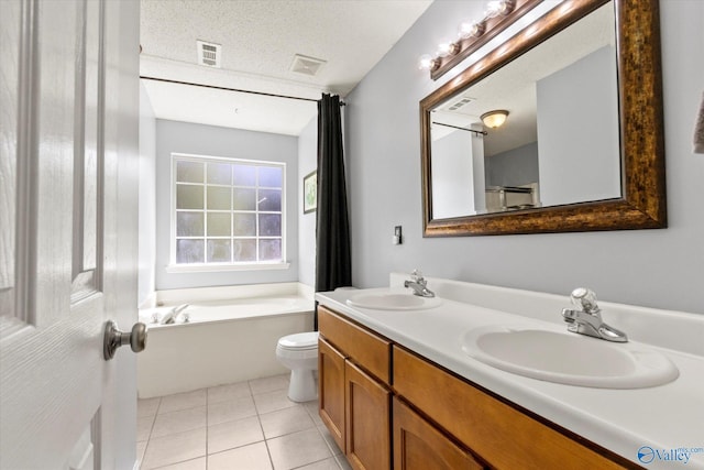 bathroom with tile patterned flooring, a sink, and visible vents