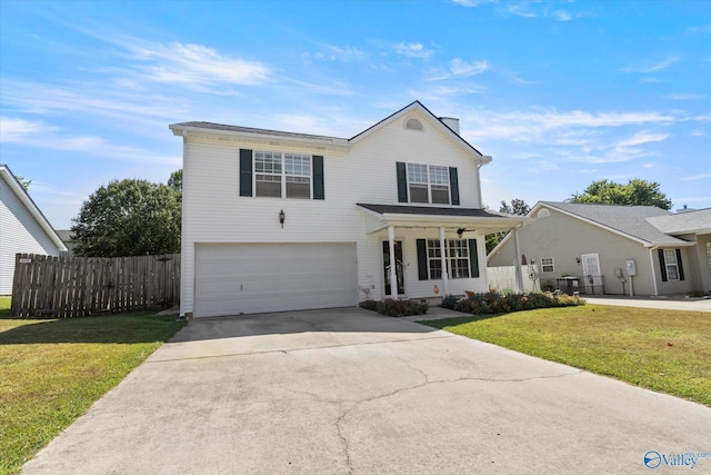 traditional home with concrete driveway, an attached garage, fence, a porch, and a front yard