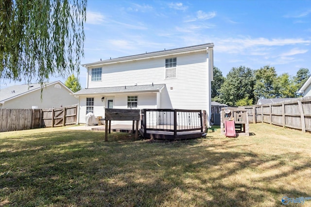 rear view of house with a yard, cooling unit, a fenced backyard, and a wooden deck