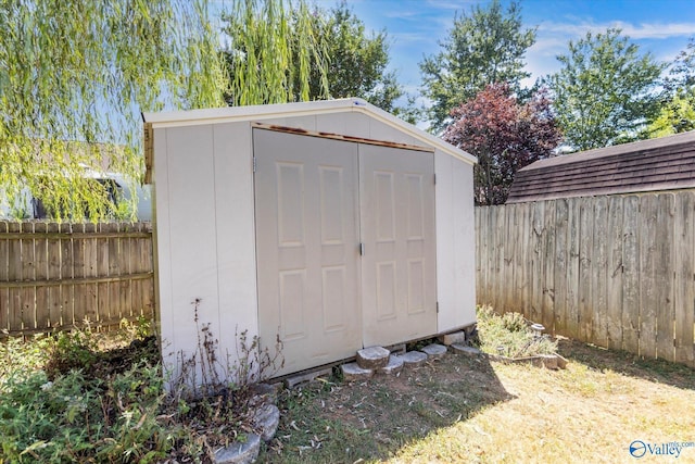 view of shed featuring a fenced backyard