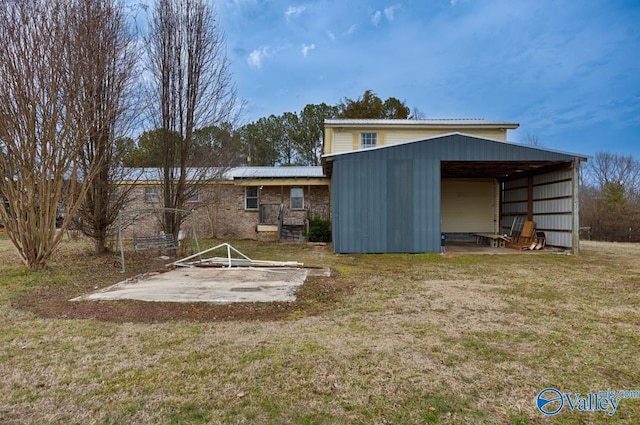 view of outbuilding featuring a lawn