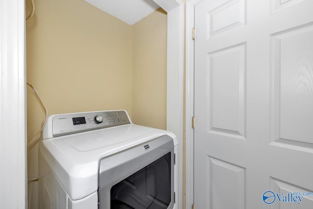 washroom with washer / clothes dryer