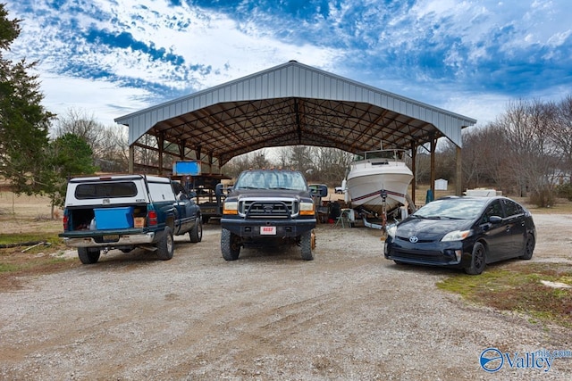 view of vehicle parking featuring a carport