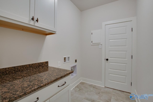 washroom featuring washer hookup, cabinet space, electric dryer hookup, and baseboards