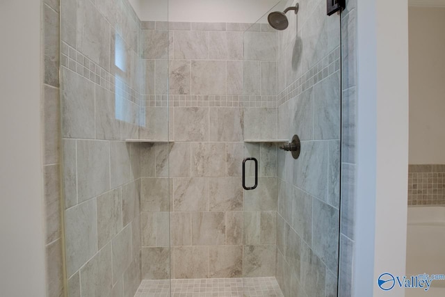 bathroom featuring a shower stall