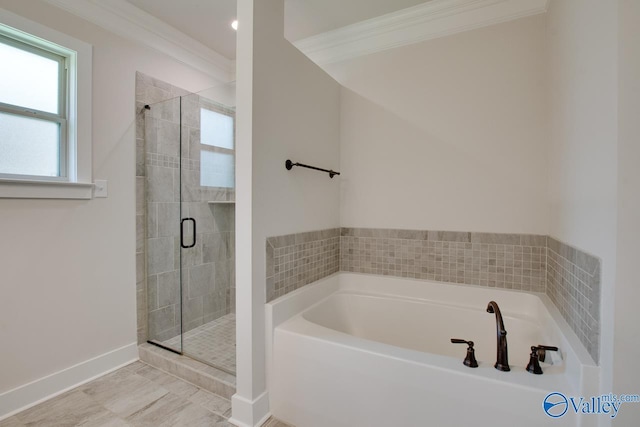 bathroom with baseboards, a shower stall, ornamental molding, and a bath