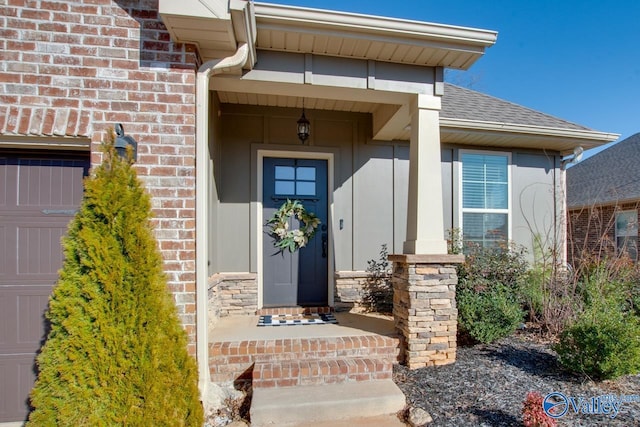 entrance to property featuring roof with shingles and brick siding