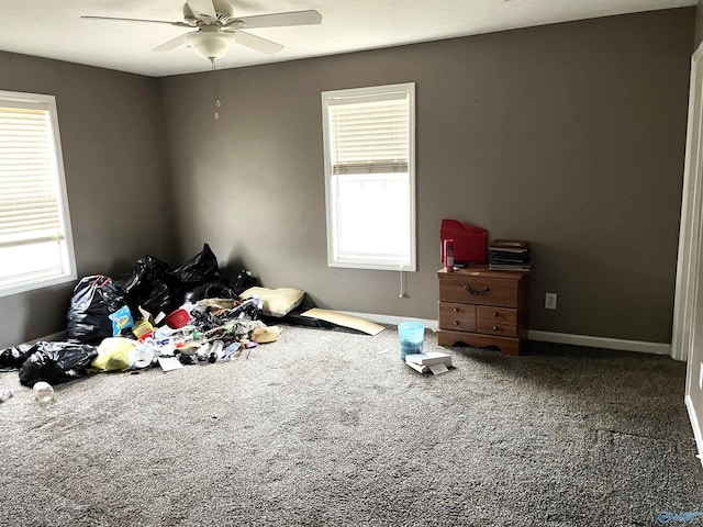 bedroom featuring multiple windows and ceiling fan