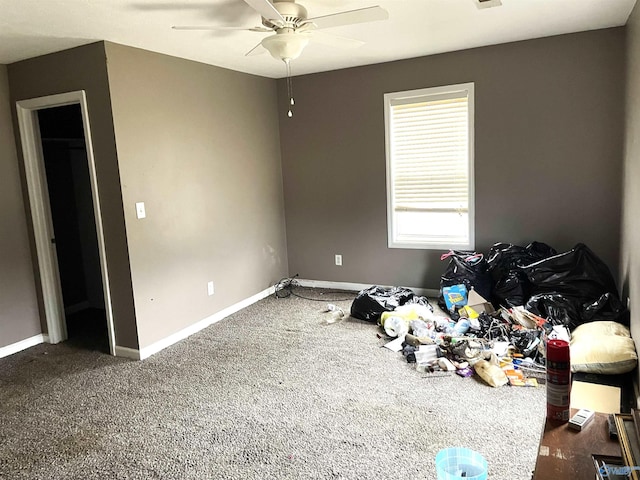 bedroom featuring dark colored carpet and ceiling fan