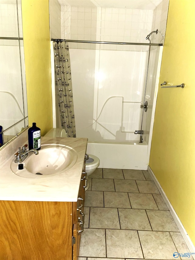 full bathroom with tile patterned flooring, vanity, toilet, and shower / bath combo with shower curtain