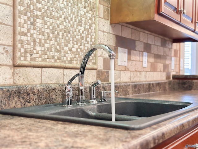 room details featuring light countertops and a sink