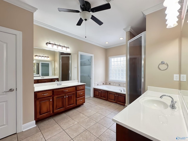 full bath featuring two vanities, ornamental molding, a shower stall, and a sink