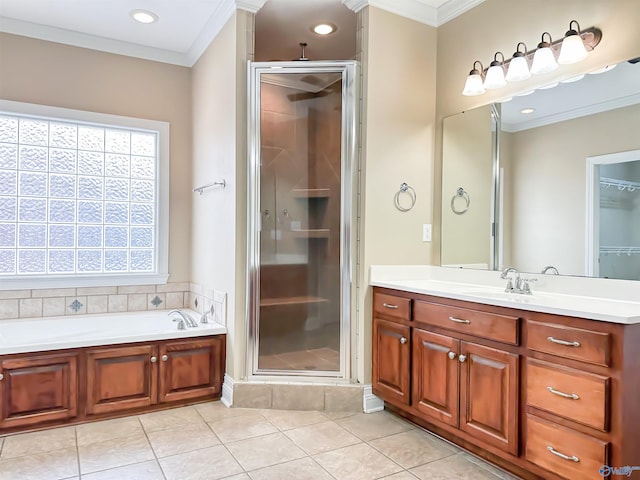 full bath with tile patterned floors, crown molding, a stall shower, a bath, and vanity