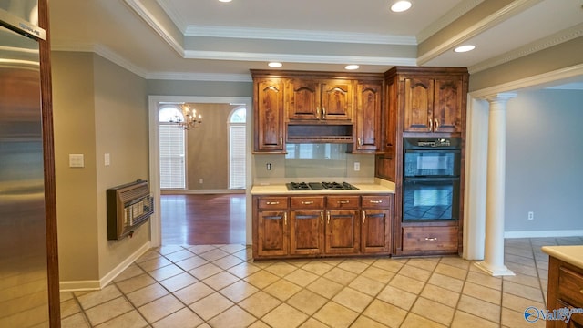 kitchen with gas cooktop, dobule oven black, decorative columns, heating unit, and stainless steel built in fridge