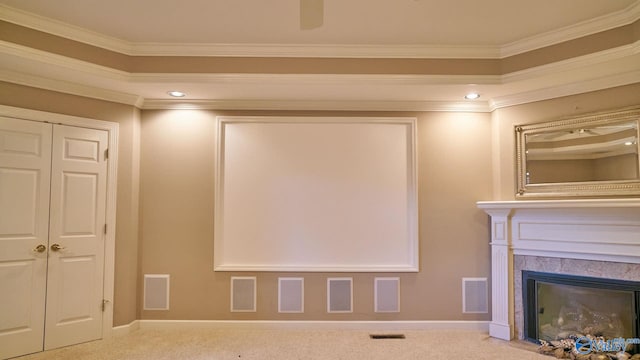 home theater featuring carpet and ornamental molding