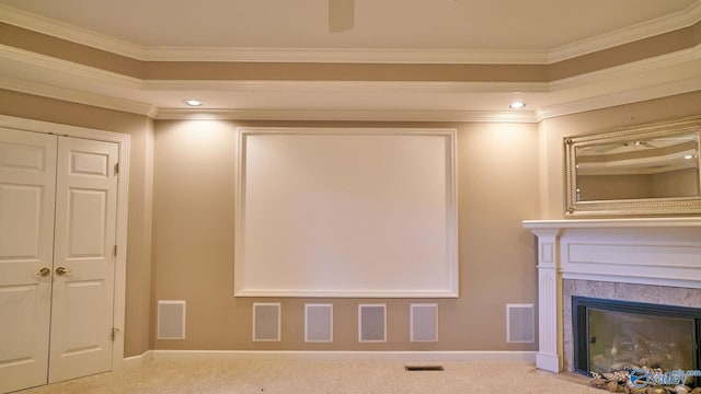 cinema room featuring baseboards, carpet flooring, and crown molding